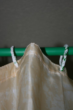 Reduce, Re-Use, RecycleThe shower rail is a water pipe off-cut and the curtain rings are plaited from plastic bags.